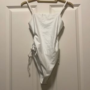 Lulus white one piece never worn new with tags and hygiene liner